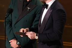 HOLLYWOOD, CALIFORNIA - MARCH 15: (L-R) Robert Downey Jr. and Chris Evans speak onstage during the 98th Oscars at Dolby Theatre on March 15, 2026 in Hollywood, California. (Photo by Kevin Winter/Getty Images)