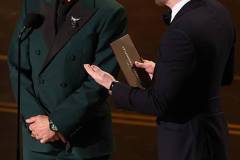 HOLLYWOOD, CALIFORNIA - MARCH 15: (L-R) Robert Downey Jr. and Chris Evans speak onstage during the 98th Oscars at Dolby Theatre on March 15, 2026 in Hollywood, California. (Photo by Kevin Winter/Getty Images)
