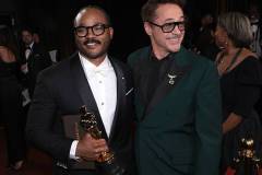 HOLLYWOOD, CALIFORNIA - MARCH 15: In this handout photo provided by The Academy, Ryan Coogler with Writing (Original Screenplay) award for "Sinners" and Robert Downey Jr. pose backstage during the 98th Oscars at Dolby Theatre on March 15, 2026 in Hollywood, California. (Photo by Al Seib / The Academy via Getty Images)