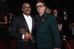 HOLLYWOOD, CALIFORNIA - MARCH 15: In this handout photo provided by The Academy, Ryan Coogler with Writing (Original Screenplay) award for "Sinners" and Robert Downey Jr. pose backstage during the 98th Oscars at Dolby Theatre on March 15, 2026 in Hollywood, California. (Photo by Al Seib / The Academy via Getty Images)